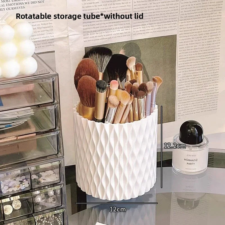 White rotating makeup brush holder organizer with various cosmetic brushes.