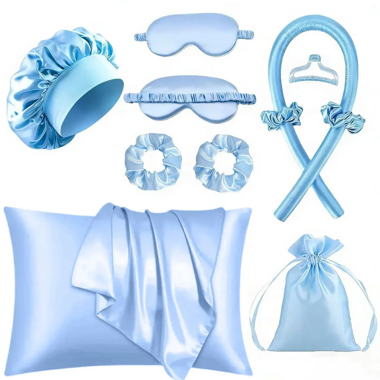 Light blue satin beauty sleep set with silk pillowcase, eye mask, hair scrunchies, and bonnet.
