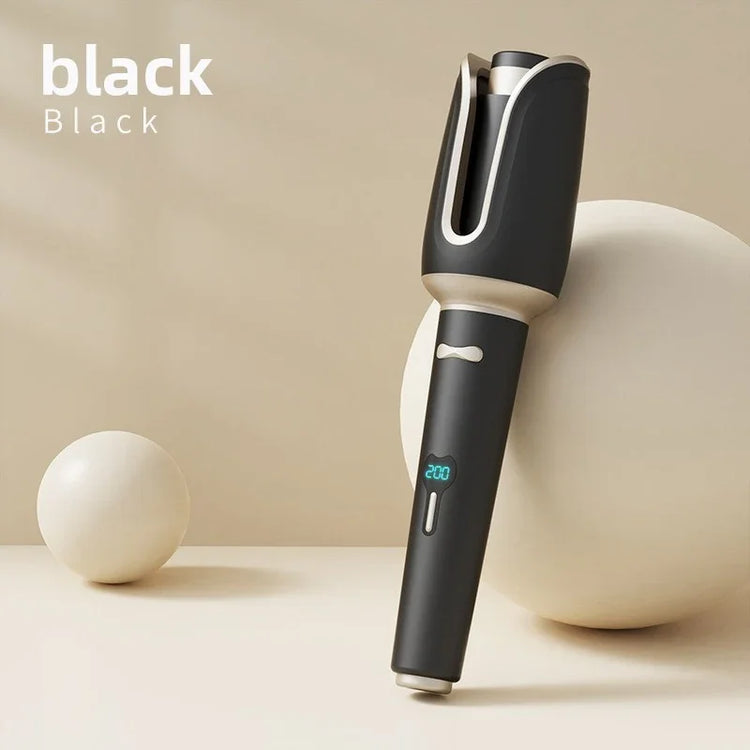 Black automatic hair curler with digital temperature display on a neutral background